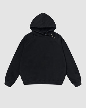 Black Fade Black Hanbok Hoodie featuring garment washed black cotton with custom dome snap hardware on hood, asymmetric closure design, pullover construction with kangaroo pocket, relaxed oversized fit silhouette, flat lay product shot on light background.