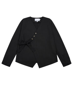 Sundae School’s BLACK HANBOK TIE BLAZER is a black long-sleeve blazer featuring a V-neckline, side tie closure inspired by the jeogori silhouette, four asymmetrical buttons, an angled hem, and a visible white tag at the neckline.