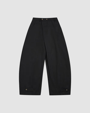 Black Hanbok Balloon Pants with wide-leg silhouette, elastic waistband, two flower-shaped buttons at the front, and adjustable button tabs at the hem.