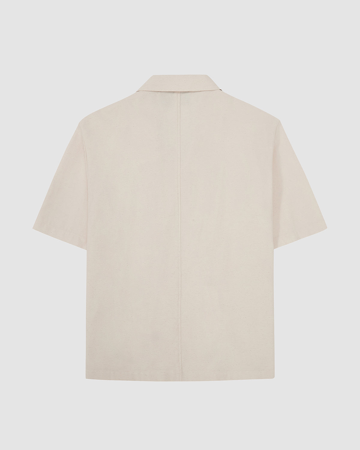 Back view flat lay of Sundae School cream hanbok short sleeve shirt showing center back seam, relaxed silhouette, and clean finishing on light gray background