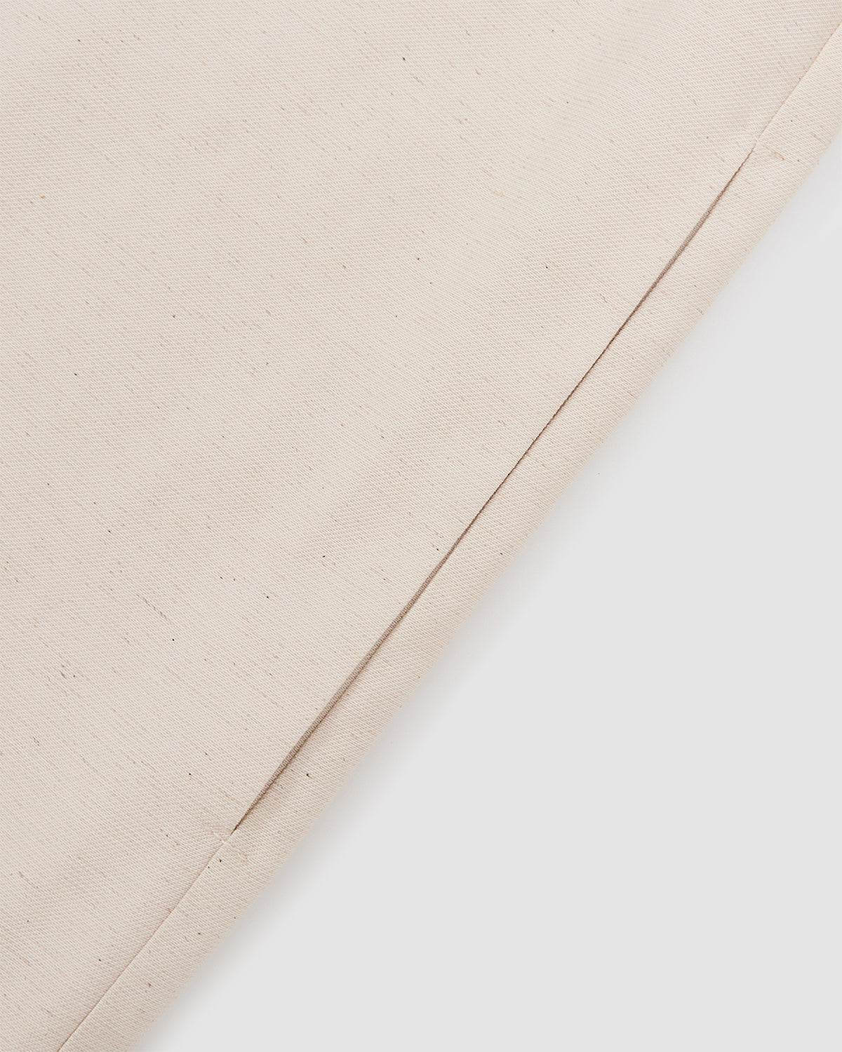 Close-up detail of cream hanbok shirt showing clean seam construction and lightweight linen blend fabric texture