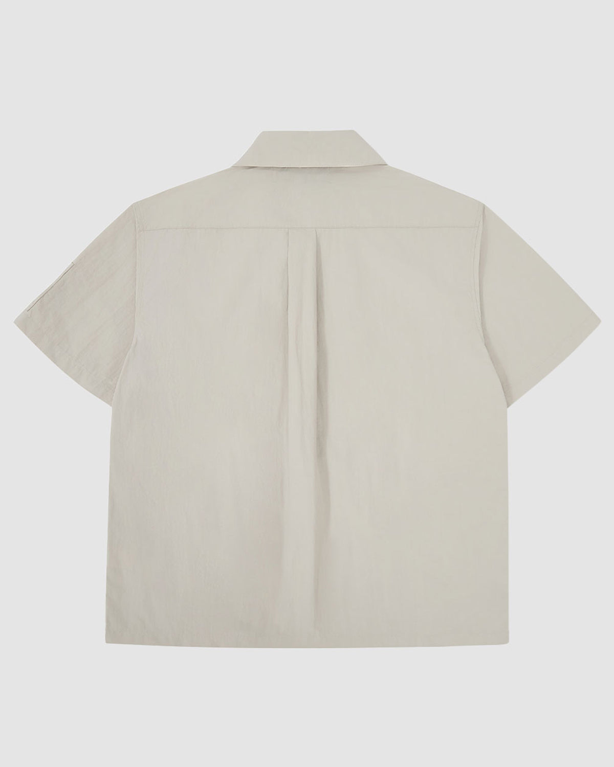 Back view of the light gray Gray Yin Yang Short Sleeve Shirt showing the clean, minimalist design with center back pleat.