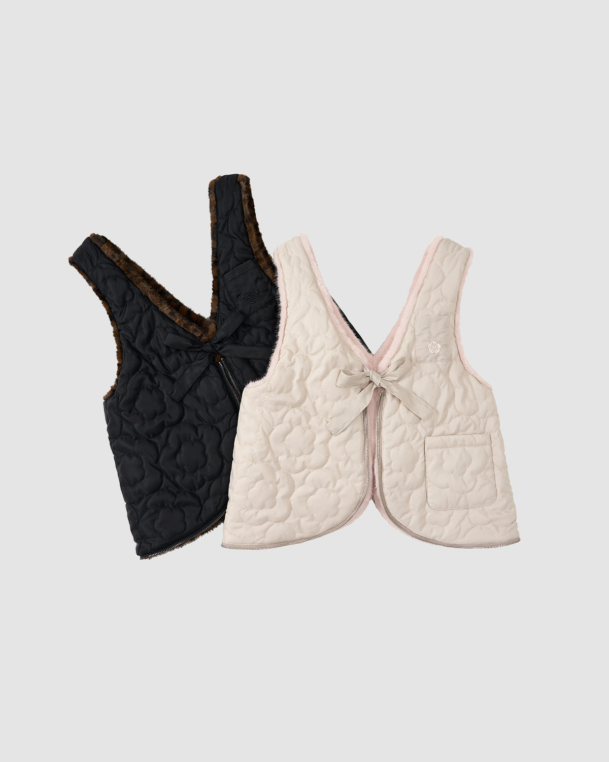 Two quilted vests are displayed: one is a black traditional Korean vest with brown lining and front tie; the other is Sundae School’s SILVER PINK BAEJA VEST / BAG, an off-white reversible vest with a front tie and small right pocket.