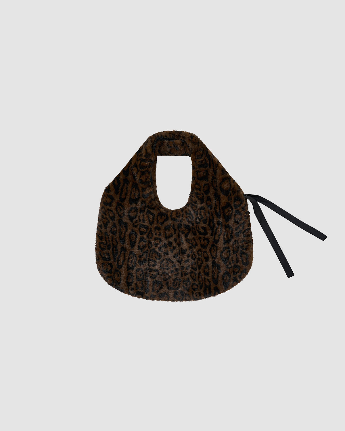 The BLACK LEOPARD BAEJA VEST / BAG by Sundae School is a brown faux fur bag with a black leopard print, short handle, and black ribbon ties, styled to complement your reversible vest or Korean baeja look—shown on a light gray background.
