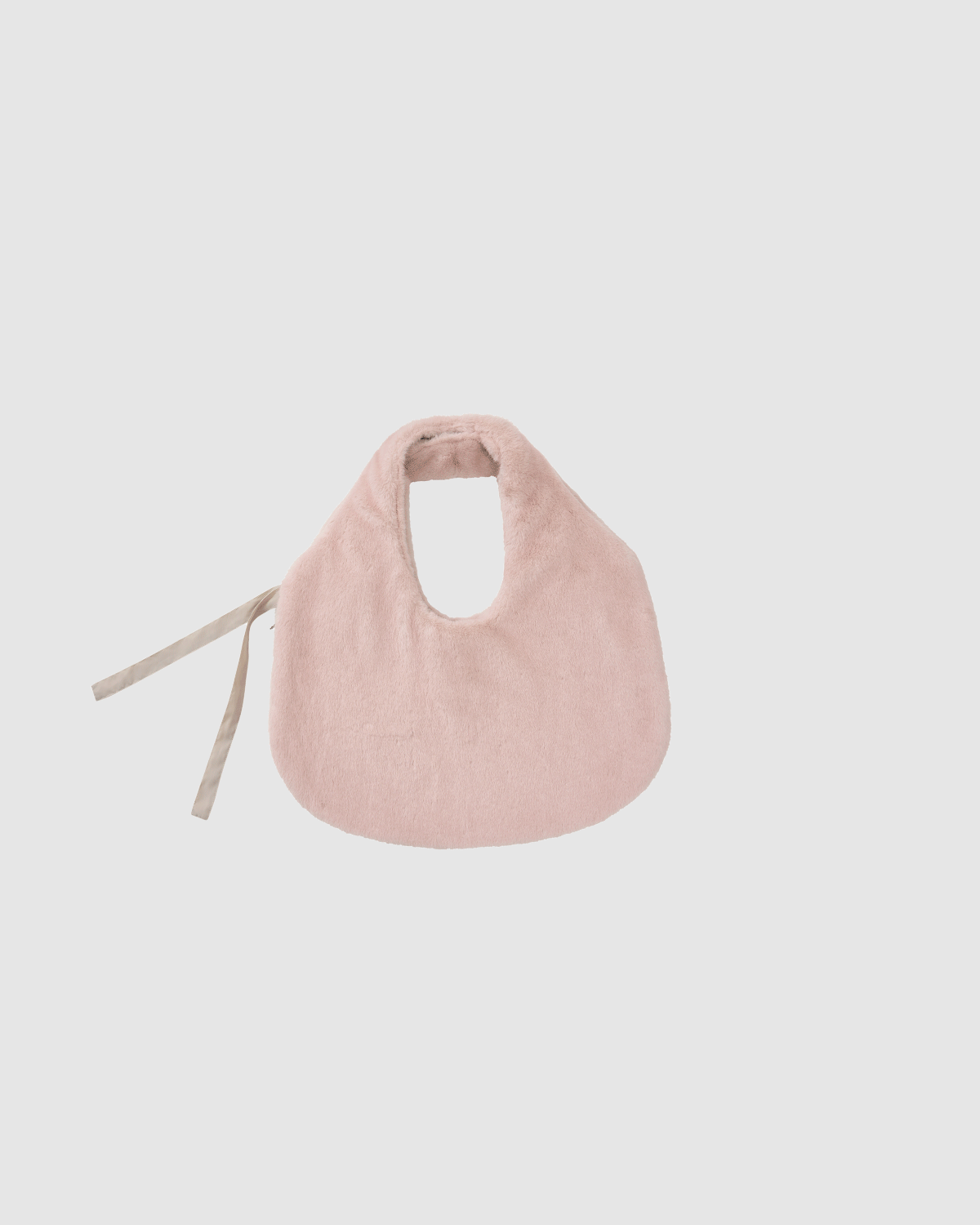 The SILVER PINK BAEJA VEST / BAG by Sundae School is a soft, pale pink baby bib with beige ties, inspired by traditional Korean vests, shown on a plain white background.