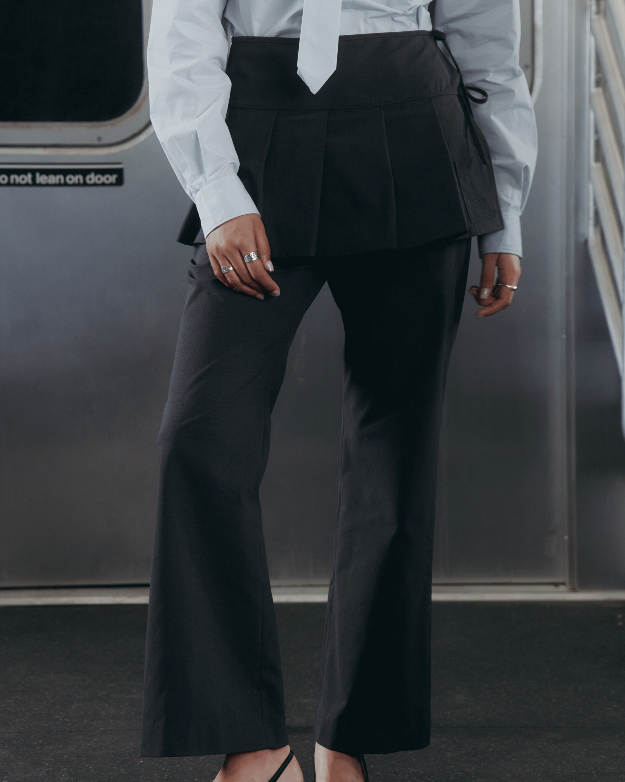 A model wearing FLARE SKIRT PANTS