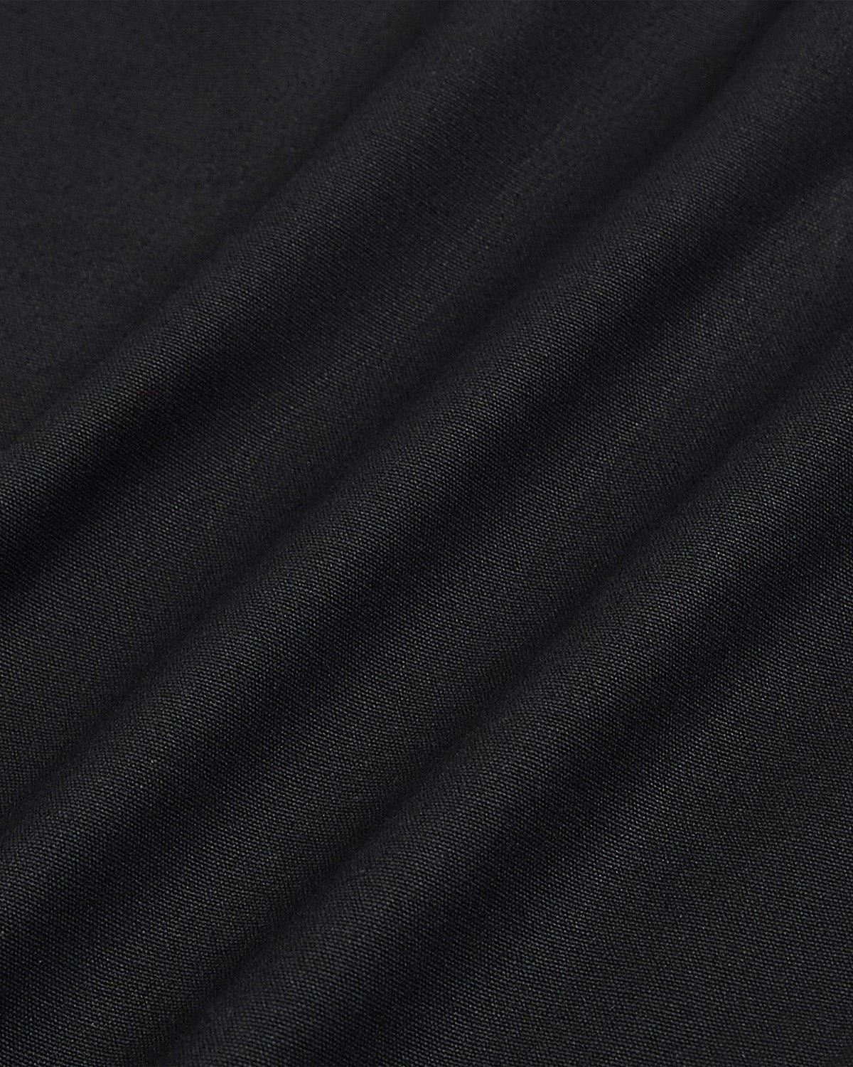 Close-up texture detail of the navy linen fabric of the Hanbok Balloon Pants showing the weave pattern.