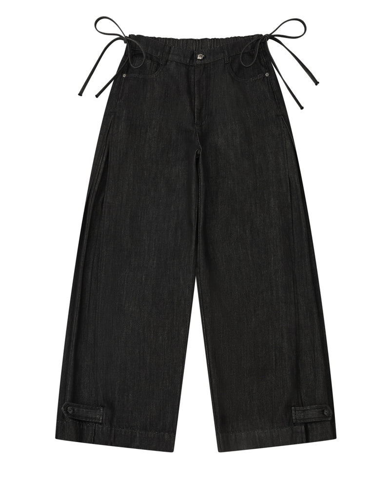 Sundae School BLACK ACCORDION DENIM PANTS: black wide-leg flare pants with inverted pleats, side ties at the waistband, and adjustable tabs at the cuffs.
