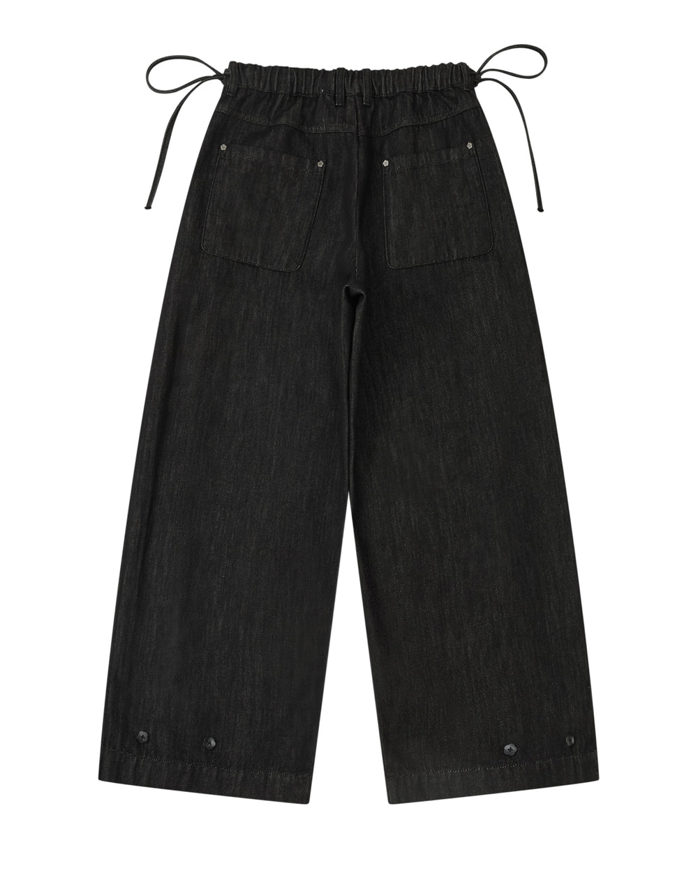BLACK ACCORDION DENIM PANTS in black, featuring a wide-leg flare cut, a drawstring waist, two back pockets, and button details at the hem.