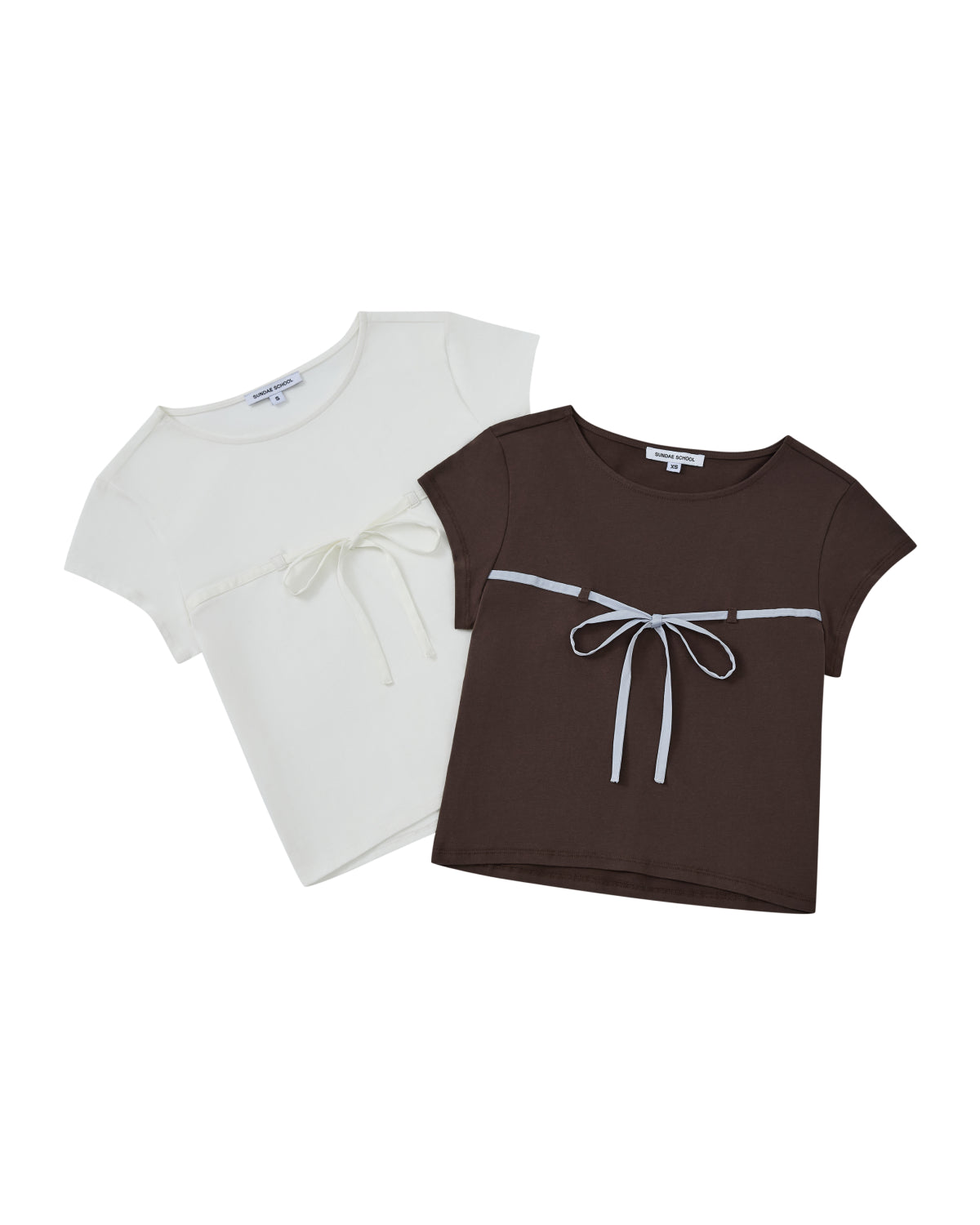 Two WHITE TIE GORUM BABY TEEs by Sundae School displayed flat: one in white and one in dark brown, both featuring a scooped neckline and a chest strap bow detail.