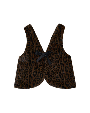 The BLACK BAEJA VEST / BAG by Sundae School is a faux fur vest featuring a brown and black leopard print pattern, inspired by the traditional Korean baeja, with a V-neckline and a black ribbon bow at the center front.