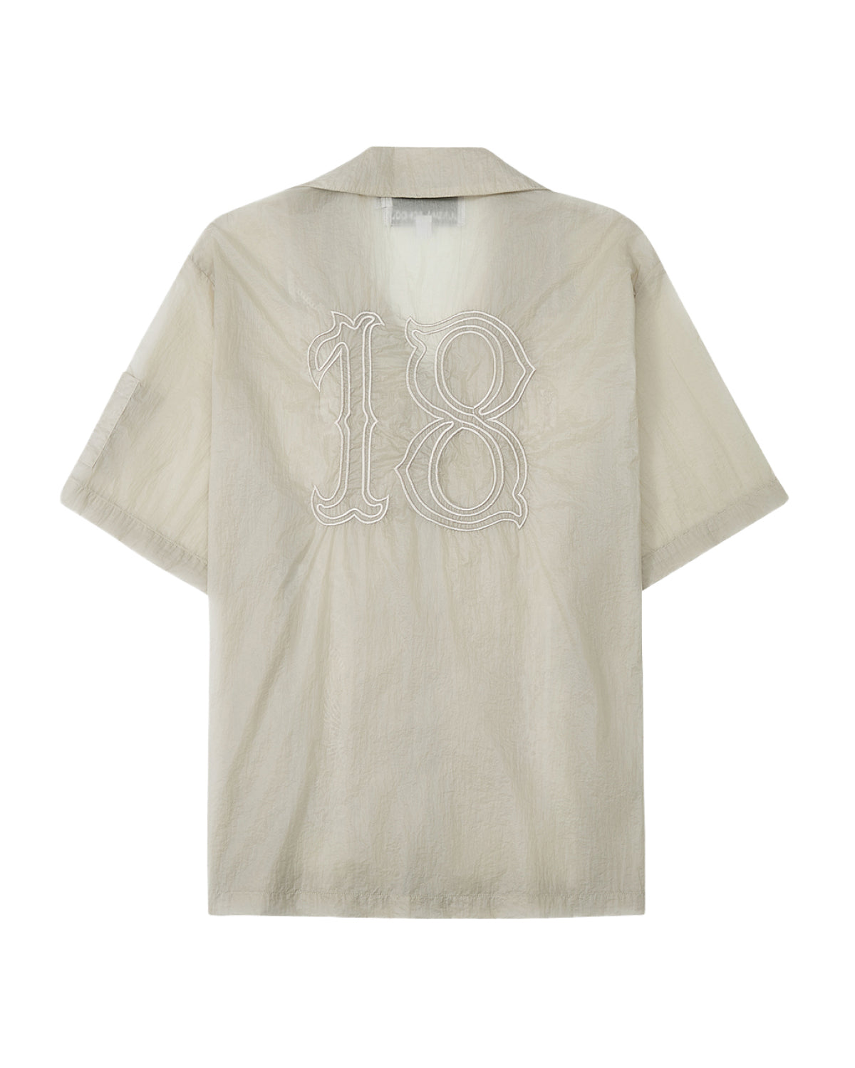 The BARONG SHIRT by Sundae School is a beige, short-sleeve collared shirt featuring a large white-outlined number 18 on the back, inspired by Filipino silhouettes and displayed against a white background.
