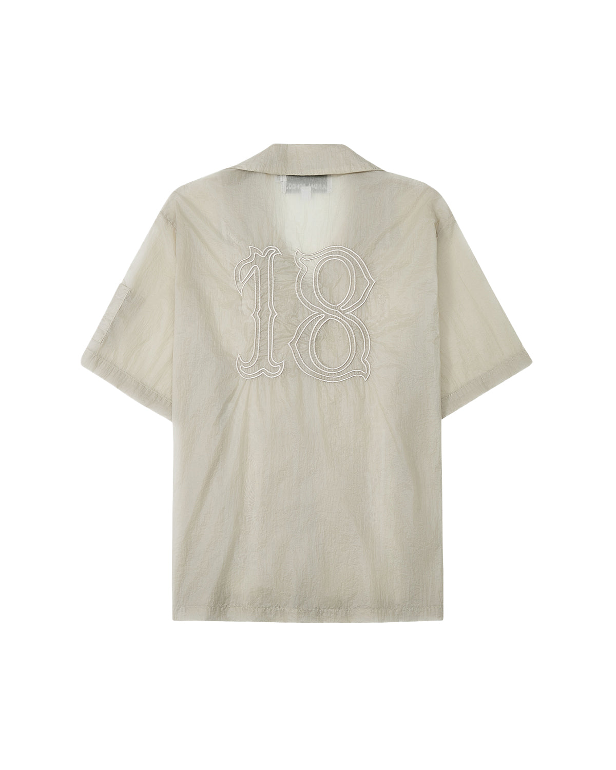 The BARONG SHIRT by Sundae School is a beige, short-sleeve collared shirt featuring a large white-outlined number 18 on the back, inspired by Filipino silhouettes and displayed against a white background.