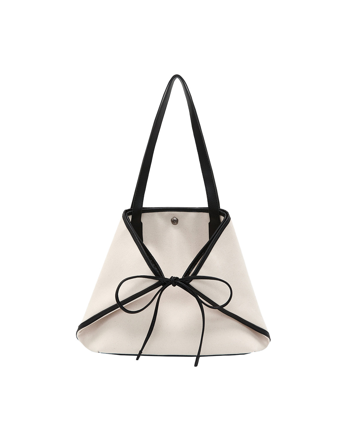 The IVORY BOJAGI TIE TOTE BAG by Sundae School is a white, triangular tote bag with black handles and a large black bow on the front, accented with vegan leather trim, displayed against a plain white background.