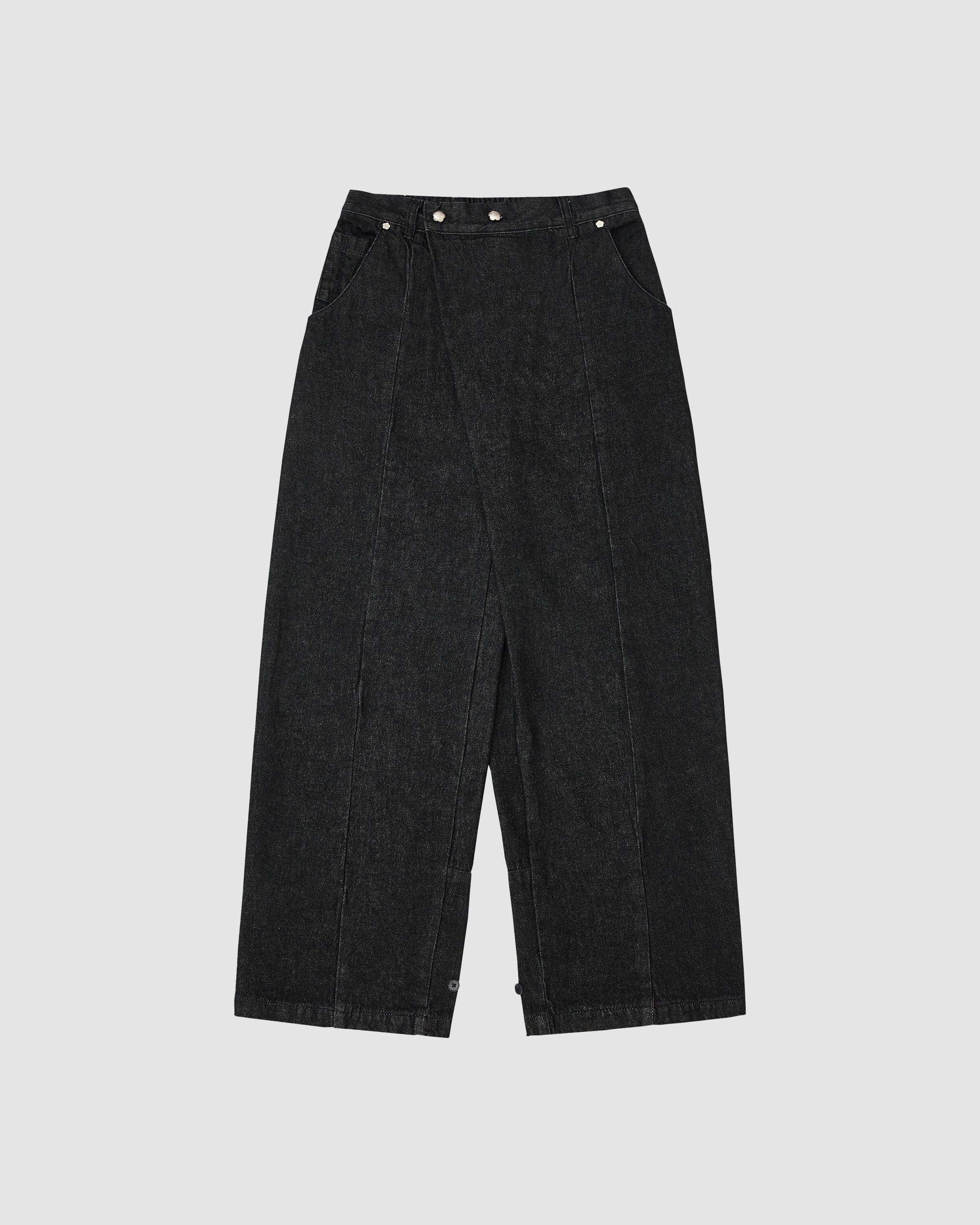 Black wide-leg hanbok denim pants with high-rise waist and asymmetric front closure featuring silver flower-shaped snap buttons, relaxed fit silhouette, flat lay photography on light gray background