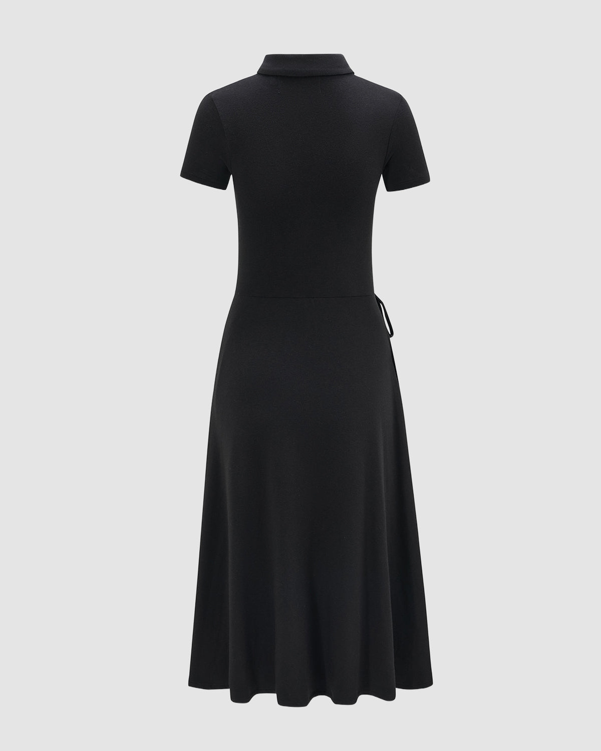 The CINDY POLO DRESS by Sundae School is shown from the back on a light gray background. This black wool dress has short sleeves, a collar, a fitted midi silhouette, and a flared skirt—perfect for summer.