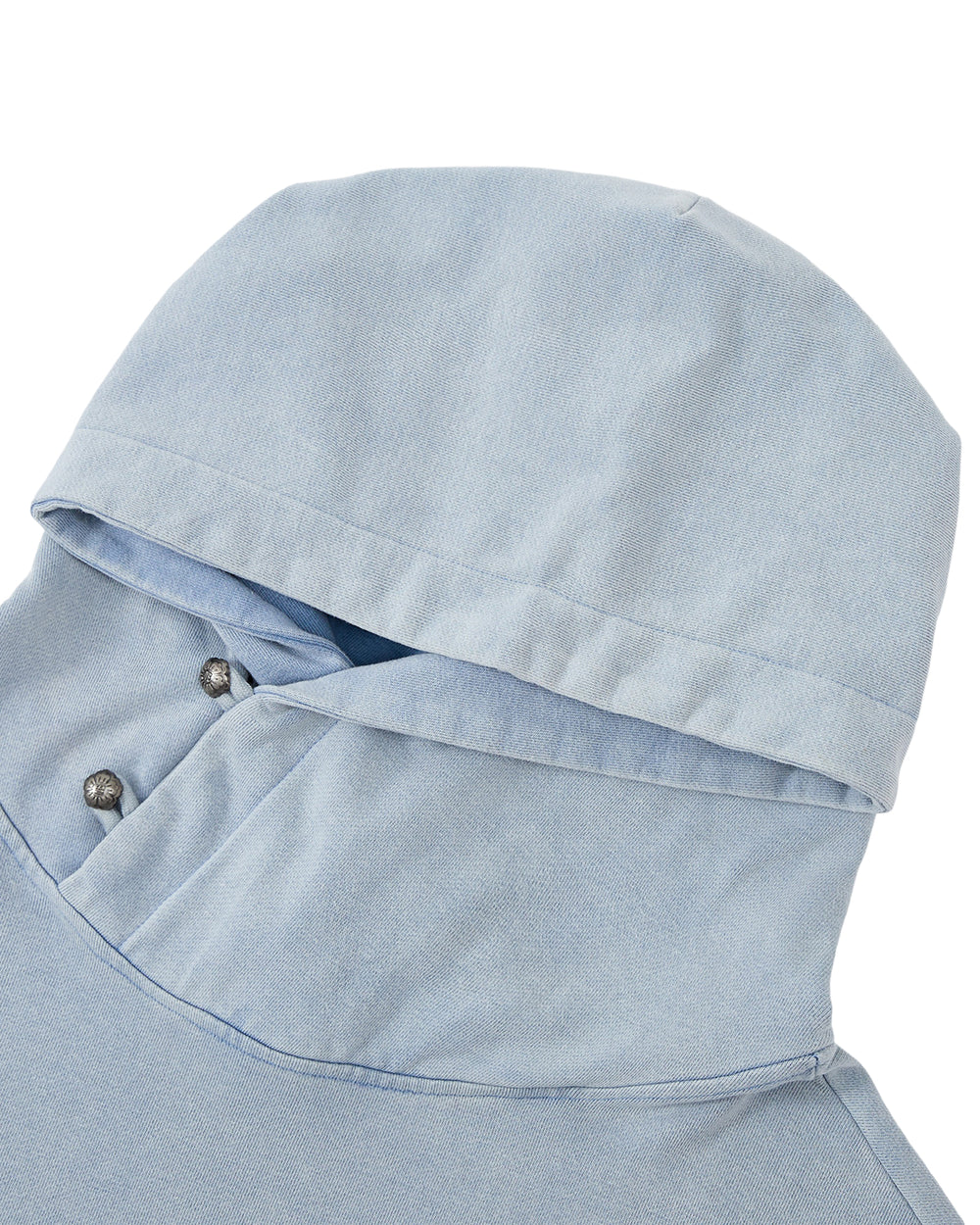 The SKY BLUE COCOON HOODIE by Sundae School is shown from above on a plain white background, featuring a light blue color, an oversized hood, and metal snap buttons at the neckline.