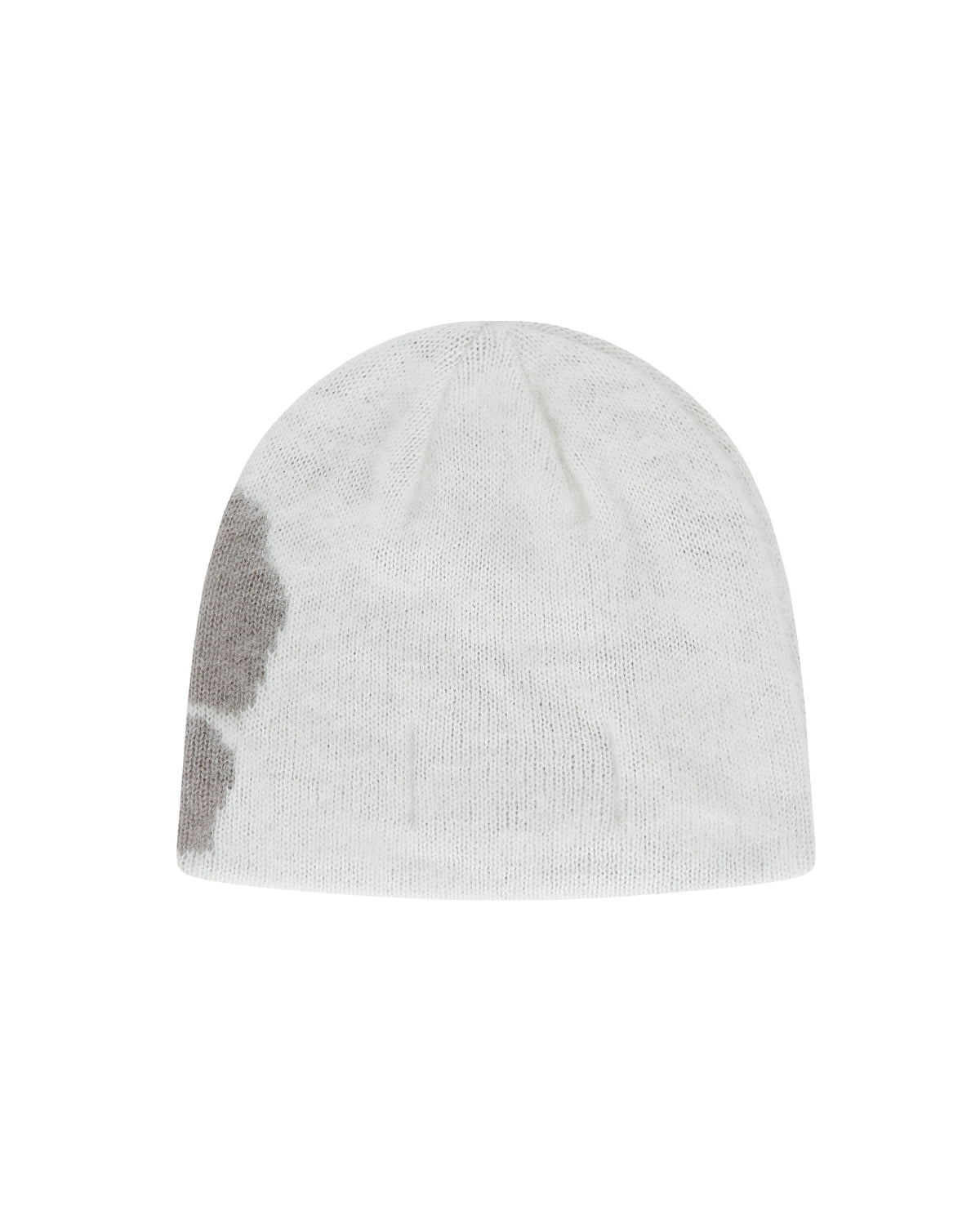 The Ivory Ddul Beanie by Sundae School is a white acrylic beanie featuring a large light gray patch on one side, shown against a plain light gray background—combining cozy style with a hint of playful protection.