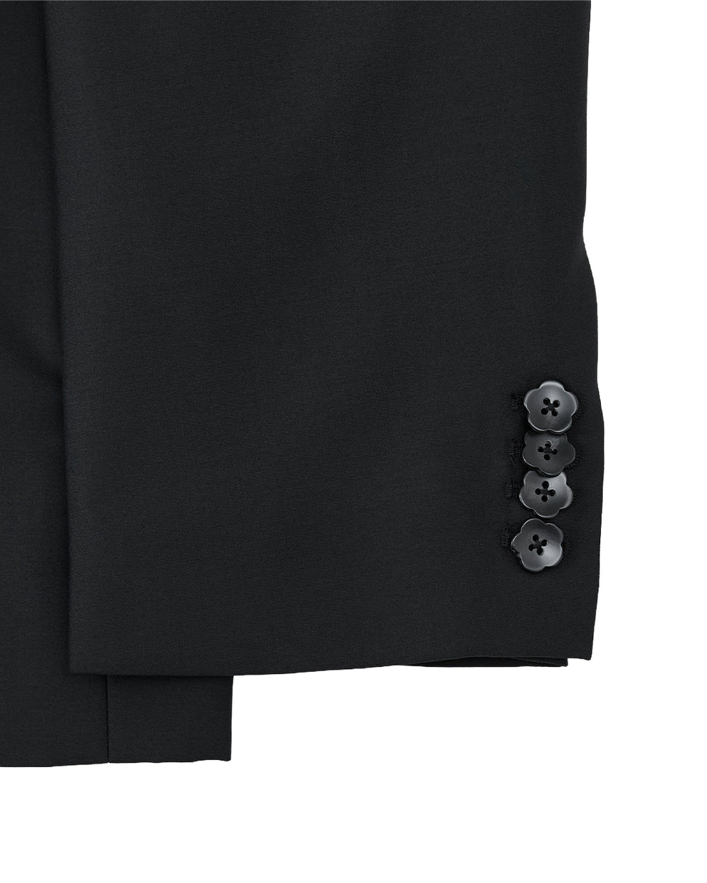 Close-up of the BLACK DOUBLE DUTY BLAZER by Sundae School: unisex black wool sleeve with four cuff buttons, set against a light gray background.