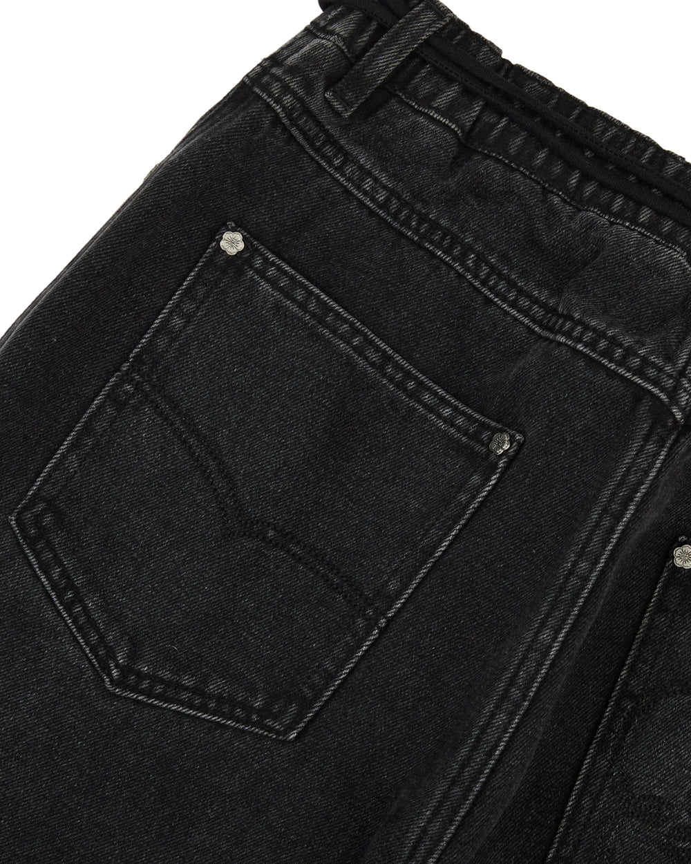 Close-up of the back pocket and waistband of a pair of Sundae School BLACK WIDOW FRESHMAN FIT DENIM jeans, featuring visible stitching and metal rivets.