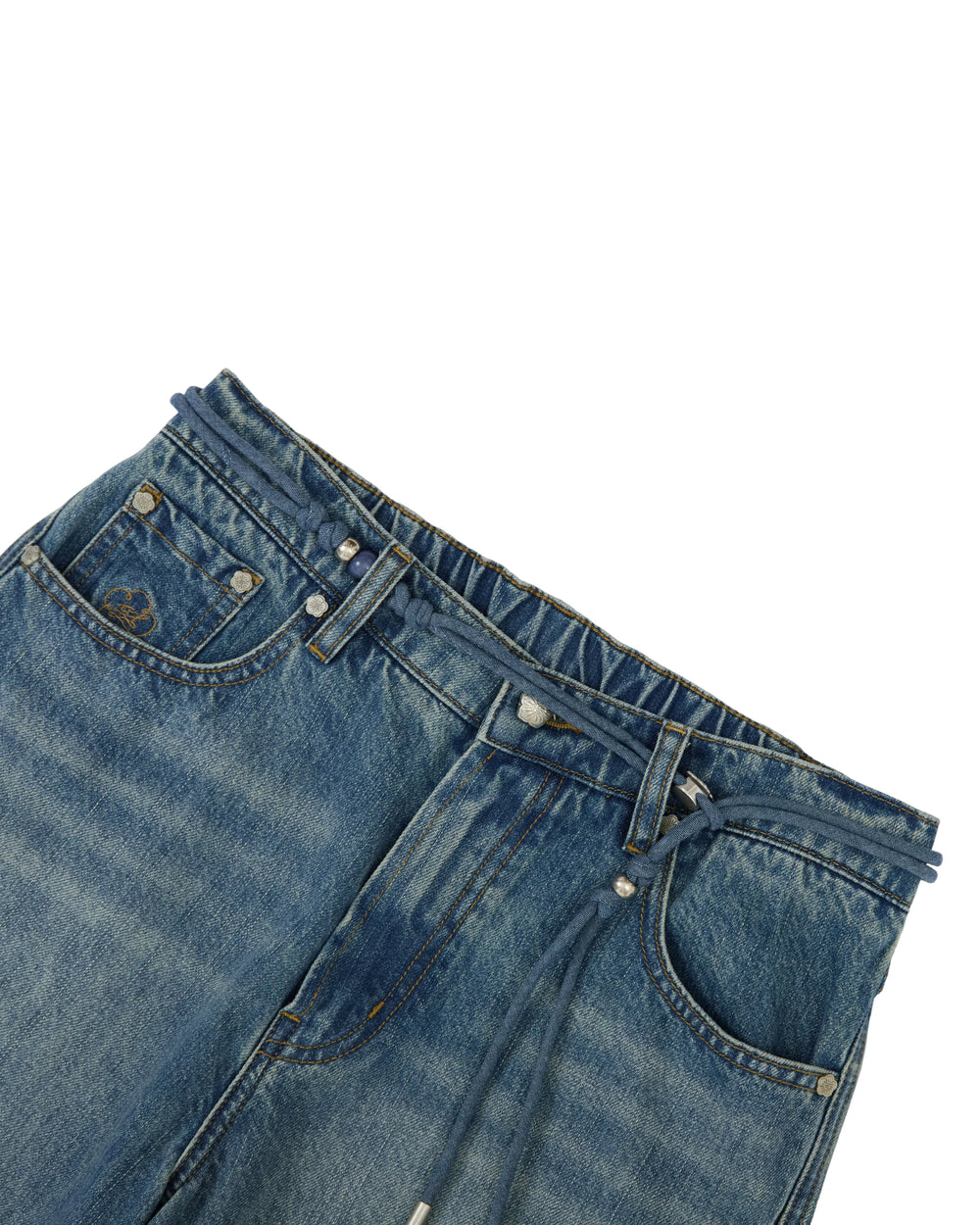 Close-up of the Sundae School MEDIUM BLUE FRESHMAN FIT DENIM, featuring an elastic waistband, front pockets, belt loops, and a visible drawstring. Inspired by the relaxed silhouette of boyfriend fit jeans, this pair highlights subtle hanbok denim influences against a clean white background.