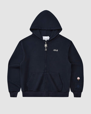 The NAVY FLOWER KNOT ZIP UP by Sundae School is a black unisex zip-up hoodie with a front pocket, drawstring hood, white embroidered chest text, and a subtle mugunghwa patch on the cuff, inspired by Korean streetwear. Displayed on a plain light background.