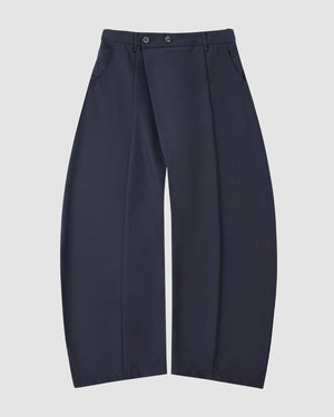 NAVY PLEATED HANBOK SLACKS by Sundae School: high-waisted wide-leg pants in navy wool blend, featuring front pleats, side pockets, and two buttons at the waistband, displayed flat on a white background.