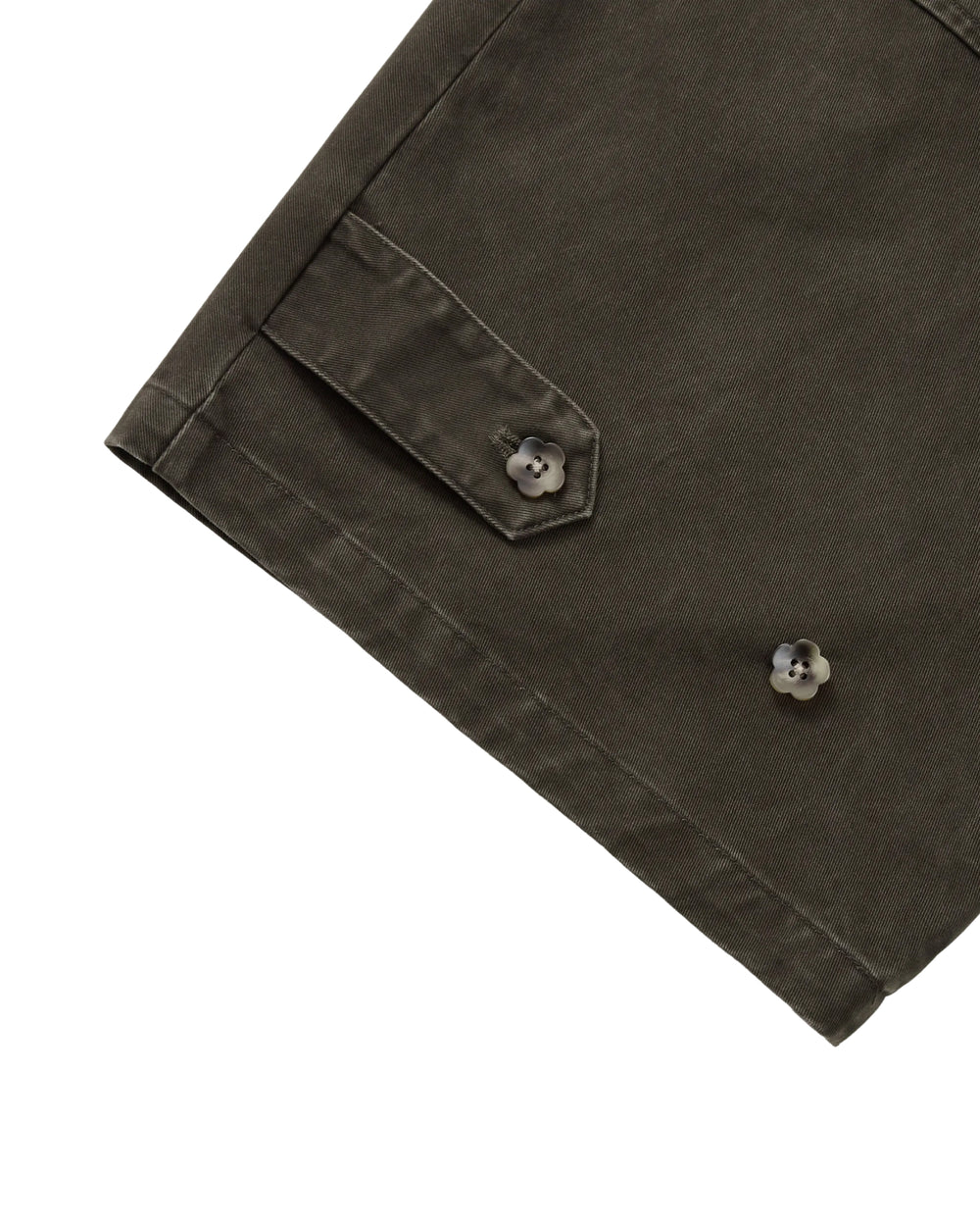 SOIL HANBOK CHINO PANTS in dark olive, featuring a barrel-fit silhouette, a buttoned flap pocket, and flower-shaped buttons.