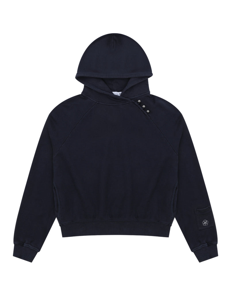 Sundae School’s NAVY WASH HANBOK HOODIE features an oversized hood, long sleeves, ribbed cuffs and hem, and three buttons on the left shoulder. Made from custom cotton, it is finished with a small embroidered patch near the left cuff.
