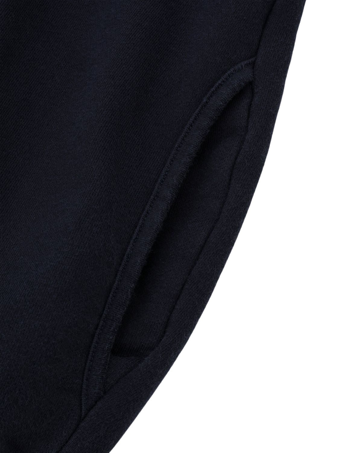 Close-up of a pocket on the NAVY WASH HANBOK HOODIE by Sundae School, showcasing custom cotton fabric in dark navy, set against a white background.