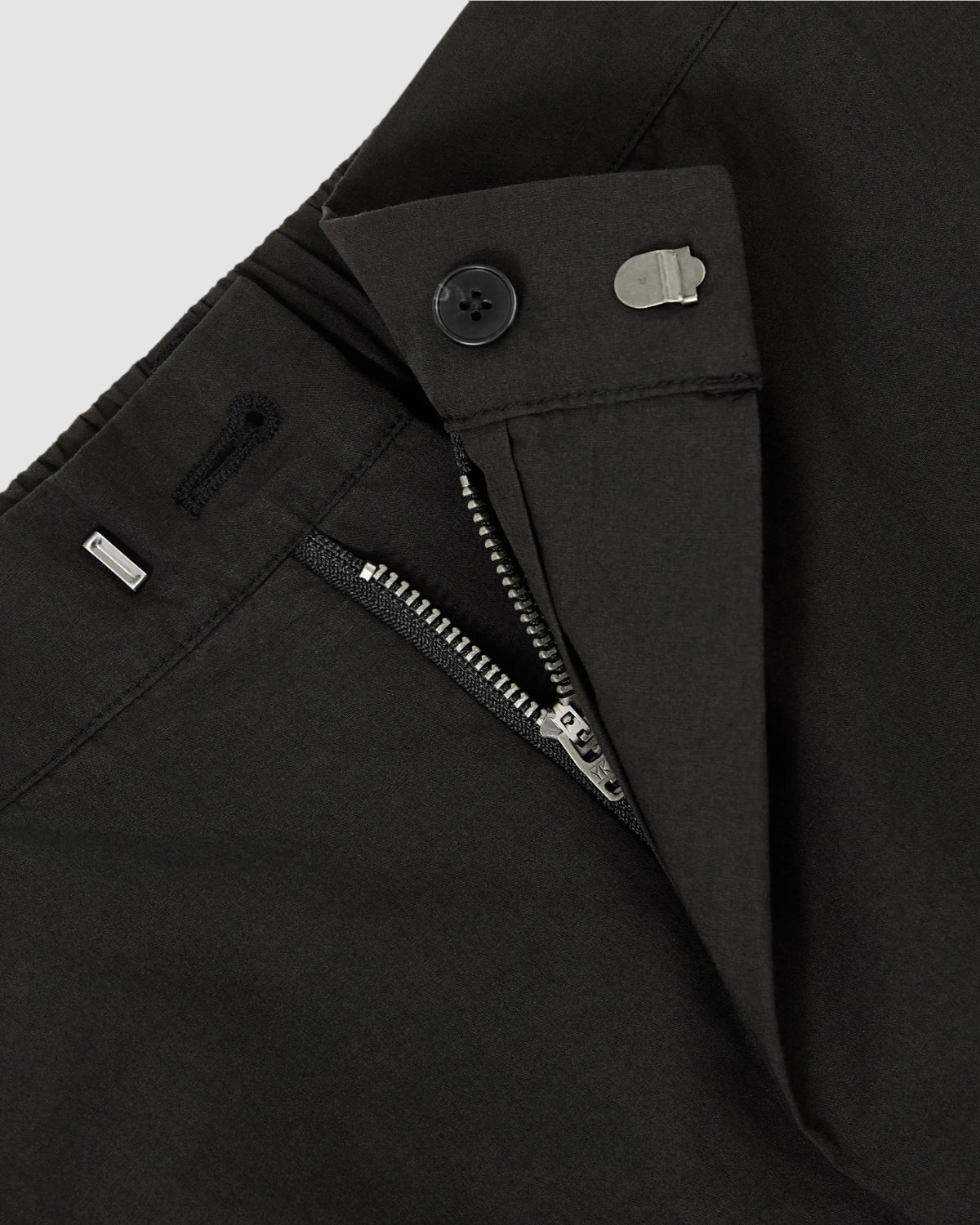 Close-up of Sundae School BLACK HANBOK LINEN PANTS featuring a wide barrel leg, partially open zipper, button, and metal hook-and-bar closure at the adjustable waist.