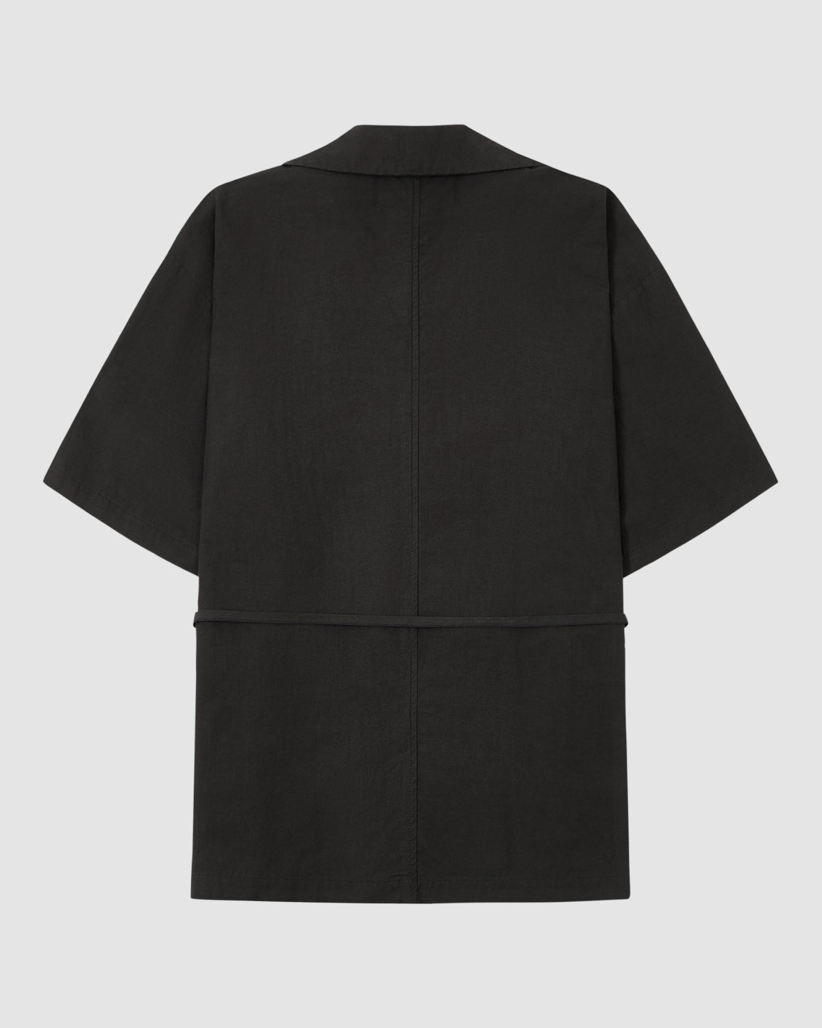 The BLACK HANBOK LINEN SHIRT by Sundae School is a black, short-sleeved, knee-length cotton-linen shirt with a straight cut and subtle center-back seam, shown against a plain light background.