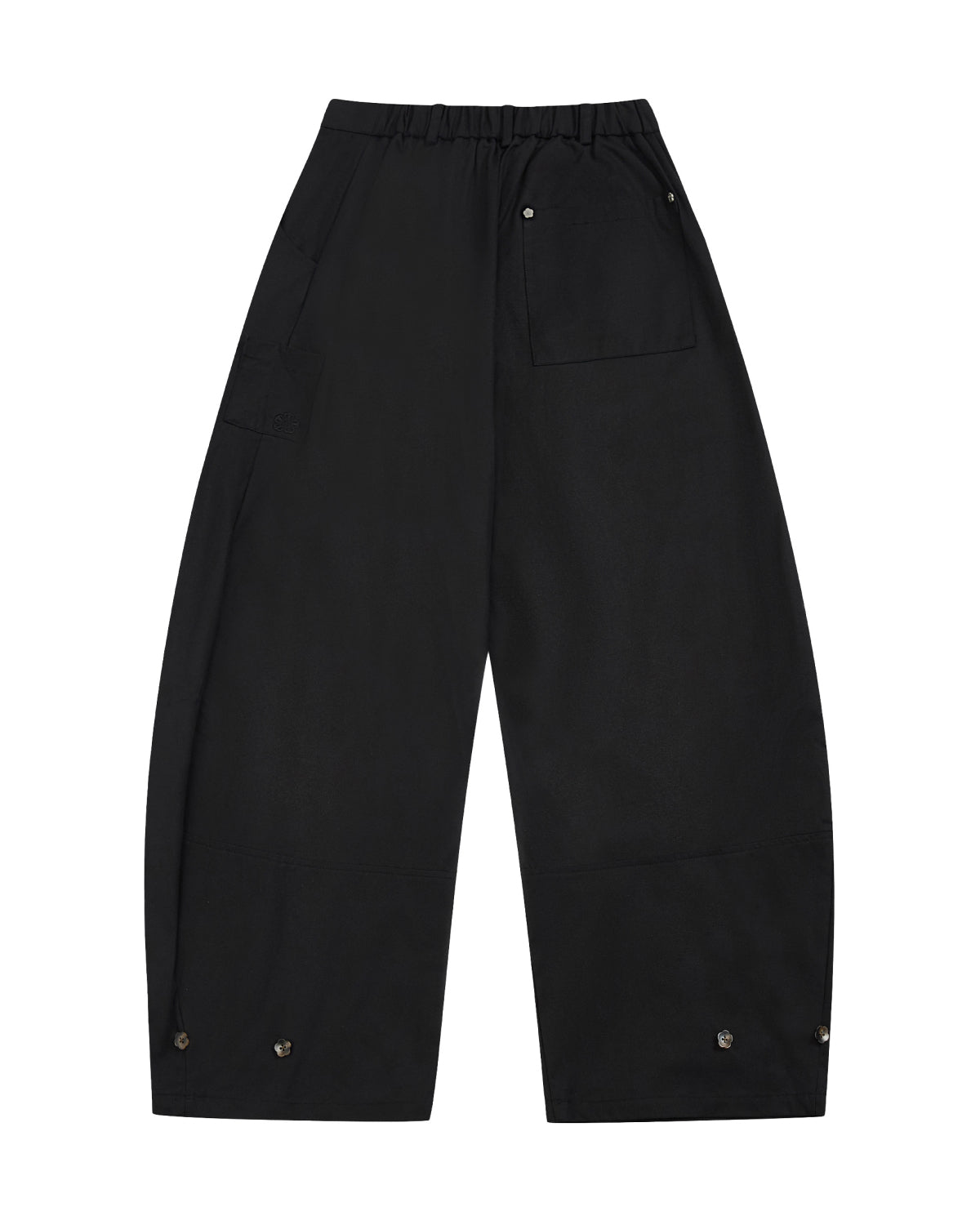 The BLACK HANBOK BALLOON PANTS by Sundae School feature a hanbok-inspired wide-leg silhouette with an elastic waistband, side and back pockets, and snap buttons at the bottom of each leg. Made from 100% cotton, the pants are displayed laid flat on a white background.