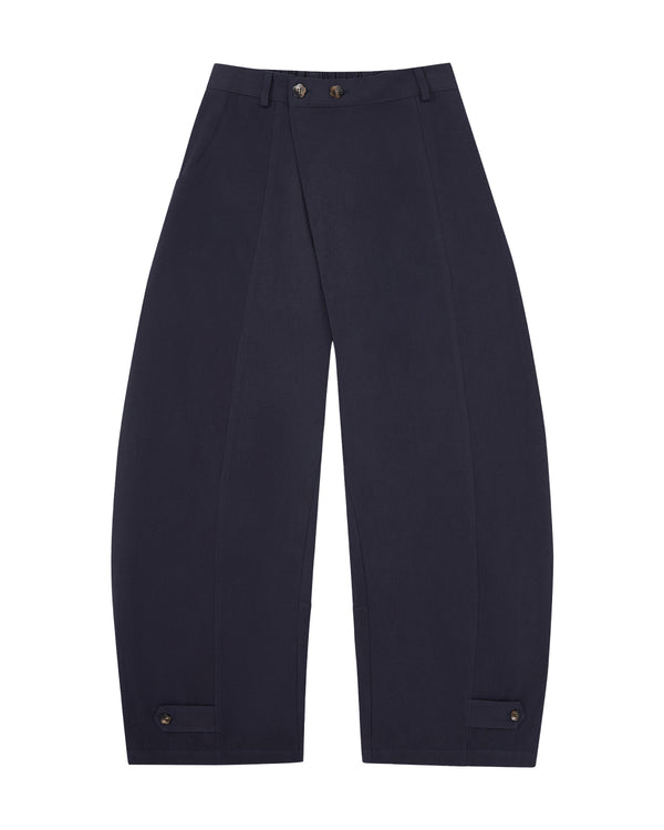 The NAVY HANBOK BALLOON PANTS by Sundae School, inspired by K-drama style, showcase a stylish balloon silhouette with wide legs, an elastic waistband, spacious front pockets, and button accents at the ankles. Crafted from breathable cotton in a navy blue shade, these pants are laid flat on a white background—perfect for elevating any casual look.