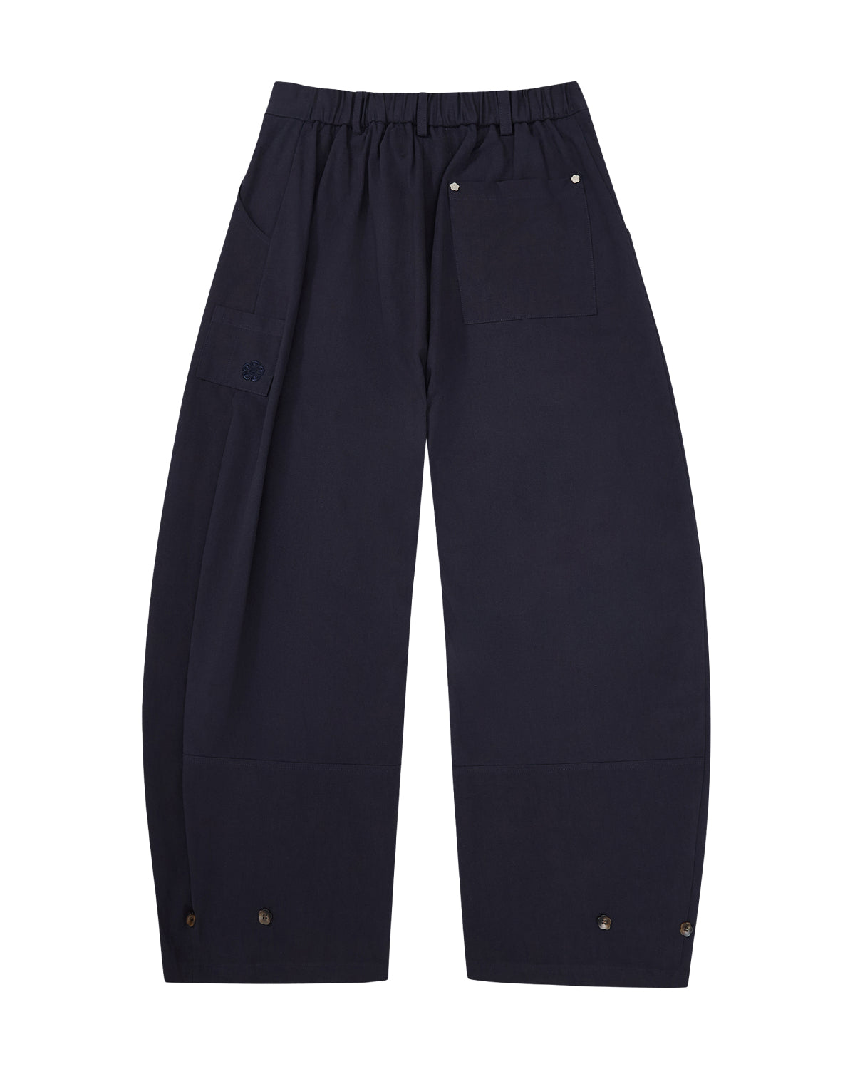 The NAVY HANBOK BALLOON PANTS by Sundae School are K-drama inspired, wide-leg navy trousers featuring a high waist, pressed front creases, and button details at the waistband and hems, shown on a white background.