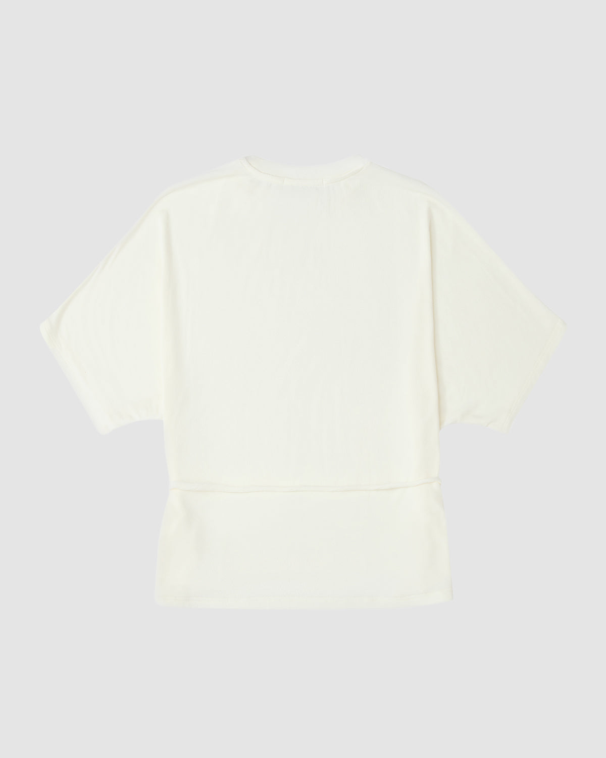 Back view of the IVORY BAERAE T-SHIRT by Sundae School, a plain, short-sleeve tee in off-white with a loose fit and minimal detailing, inspired by the clean lines of the traditional Korean durumagi overcoat. Light gray background.