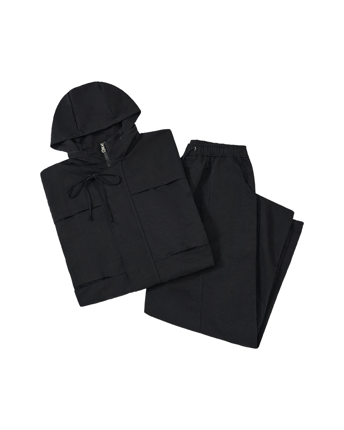 black raincoat and pants set on a light gray background