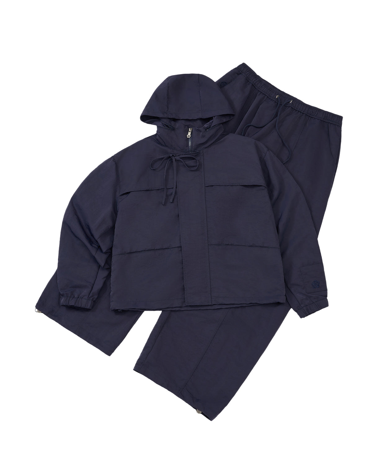 Navy blue raincoat and pants set on a light gray background