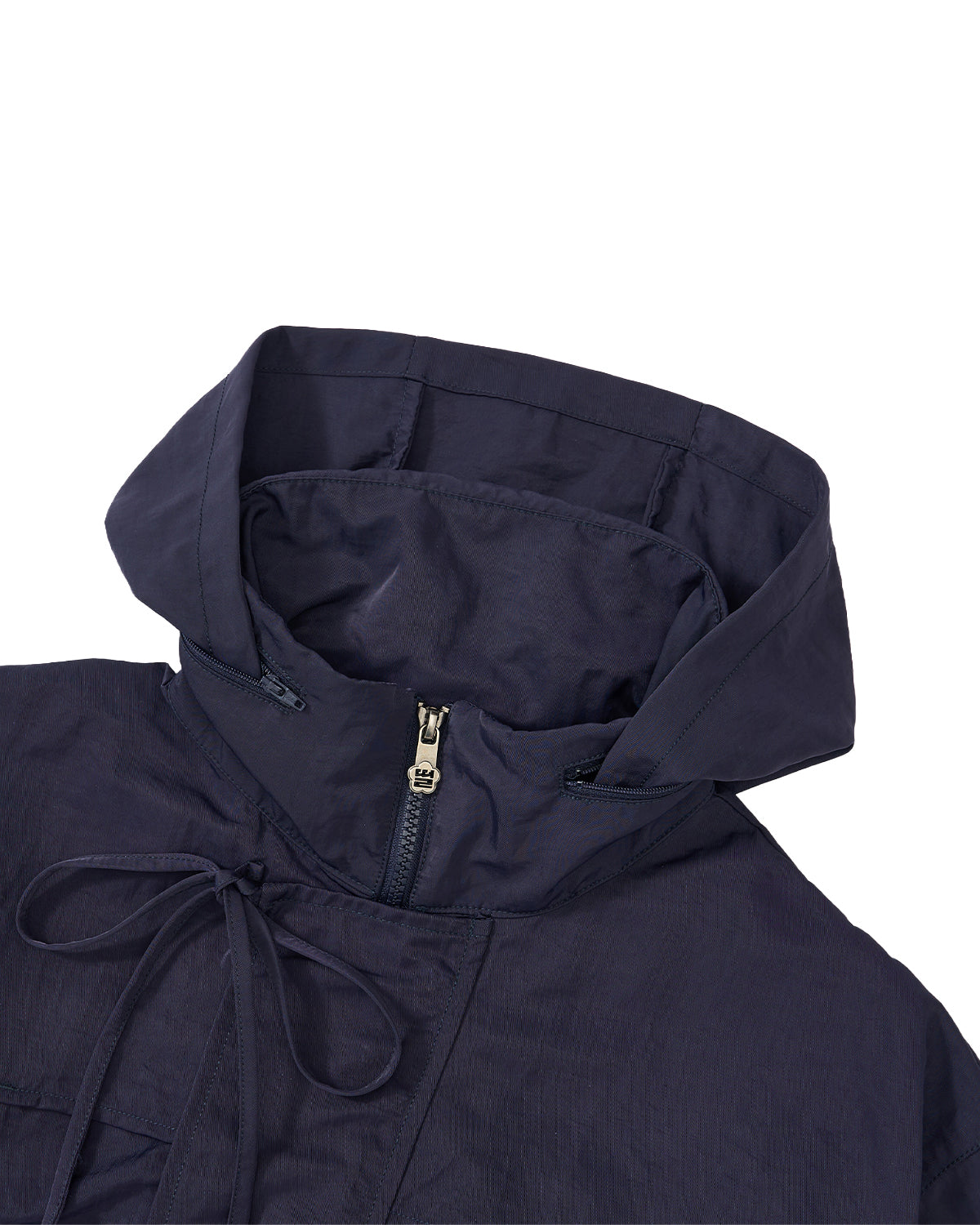 Close-up of a dark navy hooded jacket with a front zipper, drawstring hood, and a small gold-toned zipper pull, shown on a plain white background.