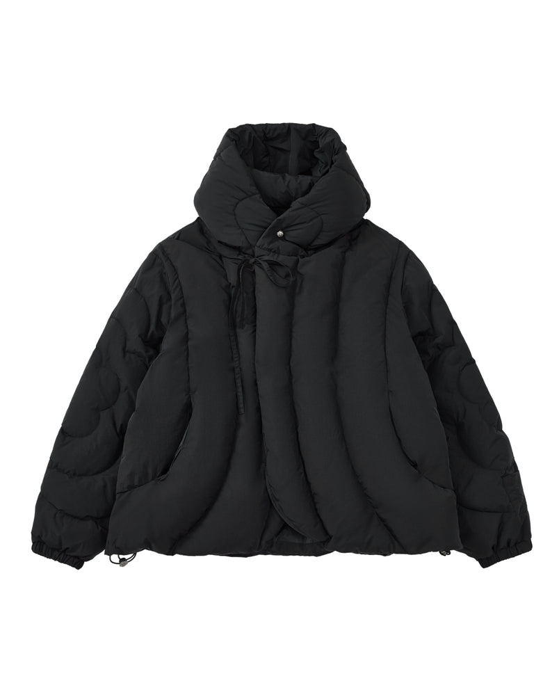 The BLACK HEAVYWEIGHT MOCHI PUFFER by Sundae School is a black, heavyweight puffer jacket featuring a high collar, large quilted sections, front button closures, side pockets, and elastic cuffs. Displayed against a plain white background, this jacket is filled with cozy duck down for enhanced warmth and comfort.