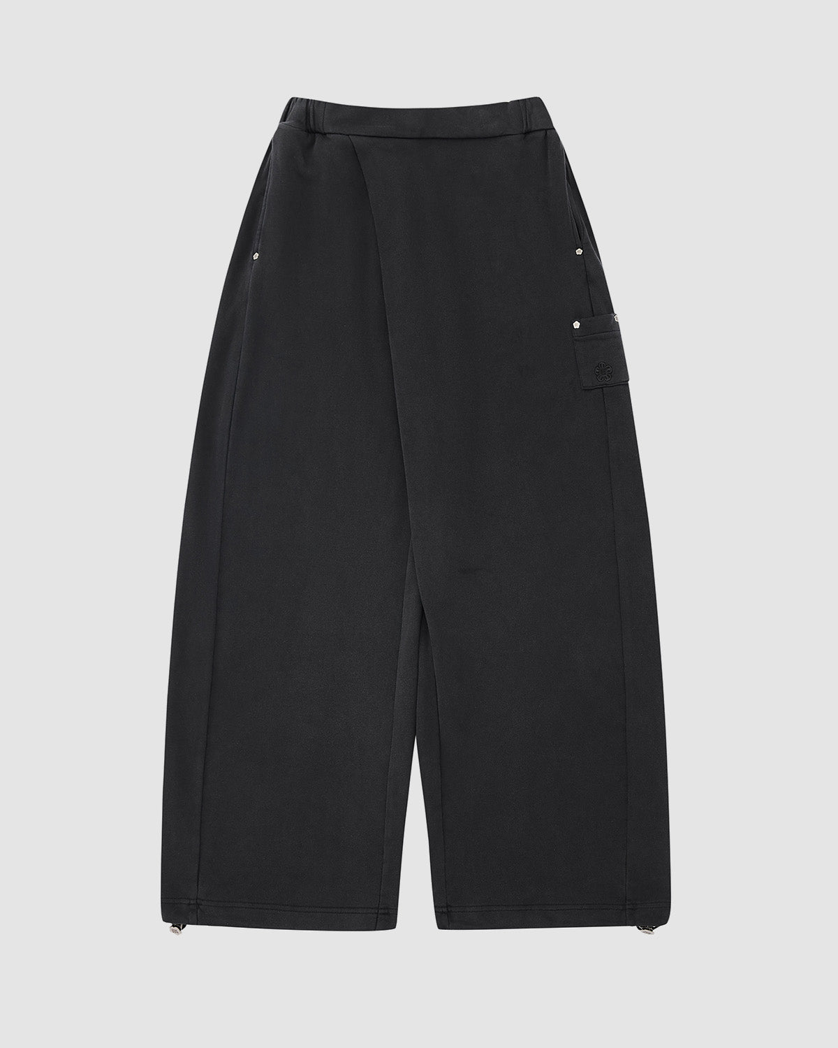 The FADE BLACK WRAP SWEATBAJI by Sundae School features a hanbok-inspired wide-leg design, overlapping front panel, side pockets, flap pocket on the right, and adjustable hem drawstrings, shown flat on a light gray background.