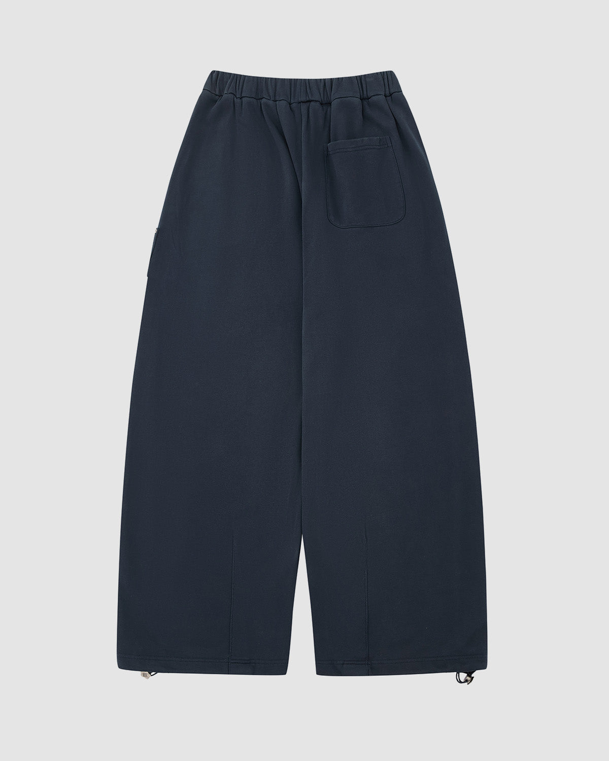 The INDIGO WASH WRAP SWEATBAJI by Sundae School are hanbok-inspired wide-leg pants with an elastic waistband, back right patch pocket, and drawstring ankle hems, shown flat on a light background.