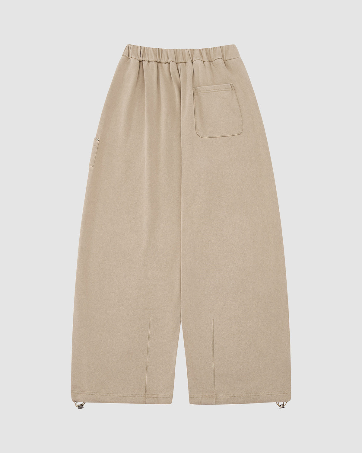 The TAUPE WRAP SWEATBAJI by Sundae School are Hanbok-inspired, wide-leg beige cotton pants with an elastic waistband, single back pocket, drawstring ankle hems, and a minimalist design.