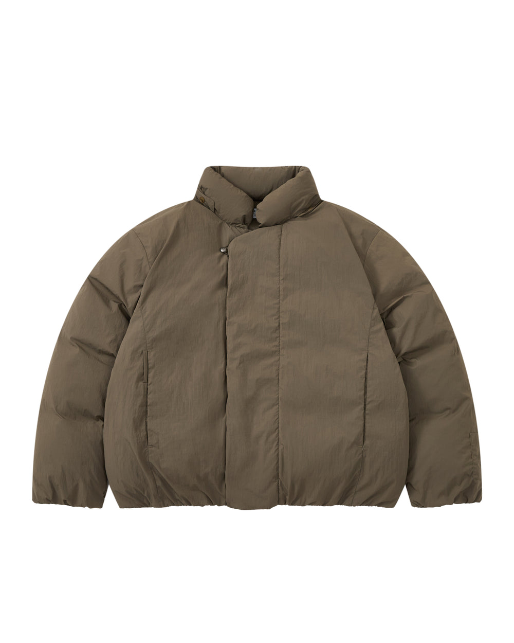 The DEEP BROWN IBUL DOWN PUFFER by Sundae School is a puffy winter jacket in a rich brown shade, featuring a high collar and long sleeves. Laid flat on a white background, this cocoon-style puffer includes a hidden front closure, side pockets, and offers a relaxed silhouette designed for cozy warmth.