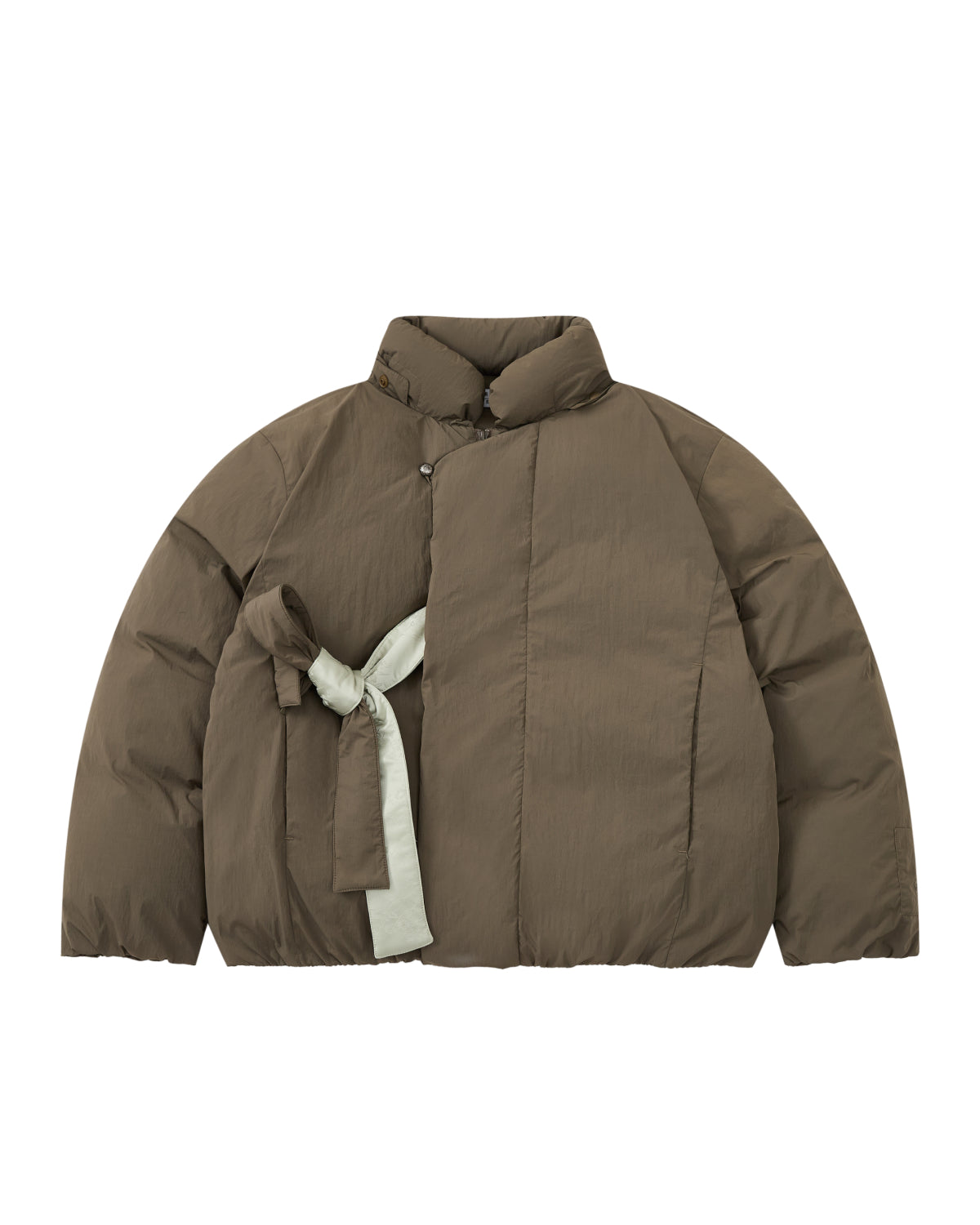 Introducing the DEEP BROWN IBUL DOWN PUFFER by Sundae School—a brown oversized cocoon puffer jacket featuring an asymmetrical design, light gray tie closure on one side, and a high collar. This modern down jacket seamlessly blends comfort and style, making it perfect for any cold-weather outfit.