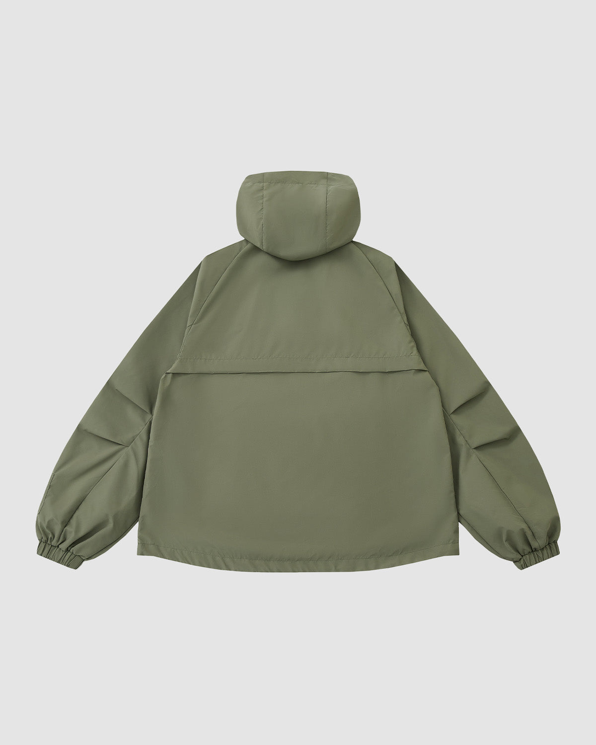 The MATCHA JEOGORI TIE SHELL JACKET by Sundae School is shown from the back on a plain light gray backdrop, featuring an olive green Korean-style loose fit, long sleeves with elastic cuffs, and a hood.