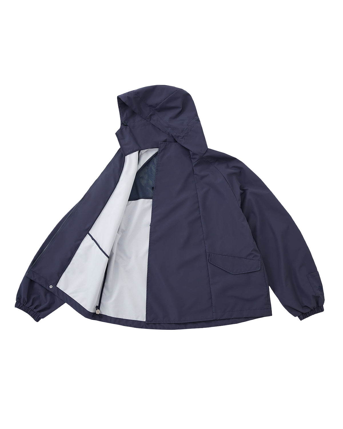 The NAVY JEOGORI TIE SHELL JACKET by Sundae School is a unisex technical outerwear piece in navy blue, featuring a water-resistant shell, elastic cuffs, long sleeves, and a relaxed fit. Shown from the back against a plain light background.