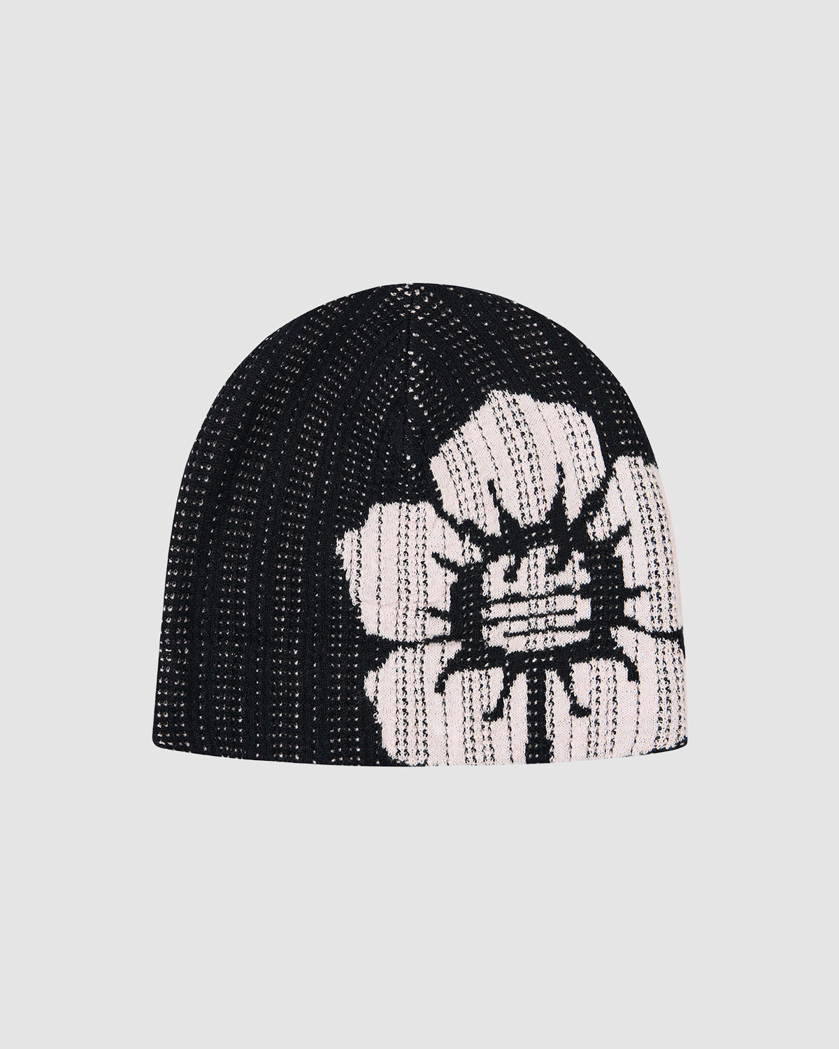 The BLACK DDUL KNIT BEANIE by Sundae School features a black ribbed design and a bold white flower graphic on the side, making this breathable knit cap a stylish addition to your wardrobe.