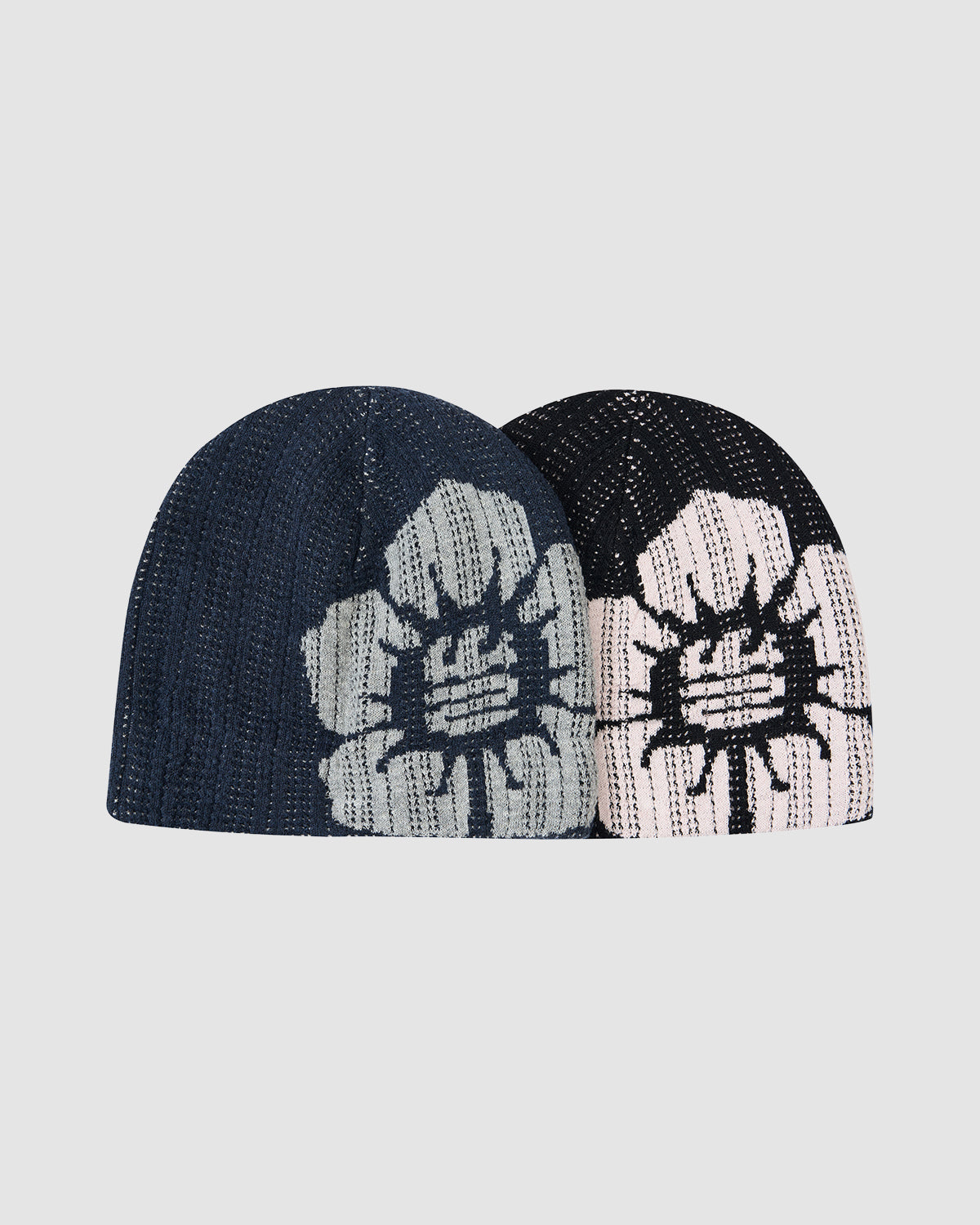 Two Sundae School BLACK DDUL KNIT BEANIE hats are shown: one in dark blue cotton jacquard with a light gray flower and the other in black with a white flower, both featuring minimalist spring designs.
