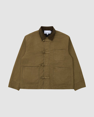 The Sundae School TAN KNOT BARN JACKET, featuring an olive green hue, three front patch pockets, a dark brown corduroy collar, and toggle button closures, is laid flat on a light gray background.